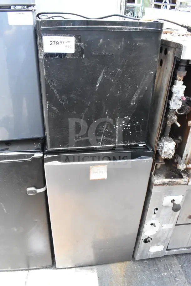 Set of 4 mini coolers including Hisense, 120 volts, 1 phase. Visible wear marks. Auction label shows "279, 4 QTY."