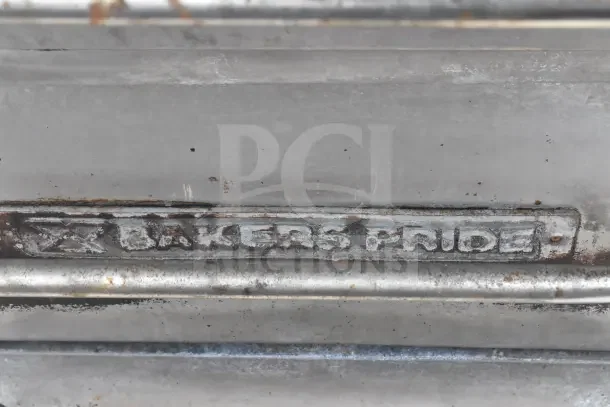 Bakers Pride commercial gas pizza oven, single deck, showing brand name on metal surface with visible wear.