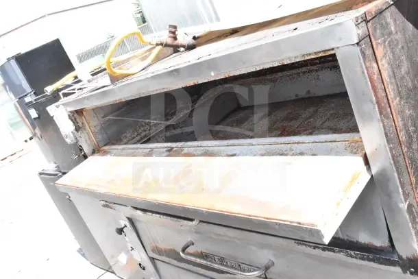 Bakers Pride commercial gas pizza oven, single deck, showing signs of wear and rust. Includes gas hookup.