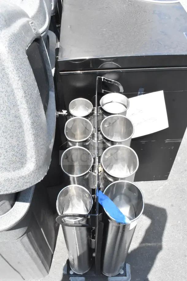 Portable 8 Well Cup Dispenser Unit with metal wells, mounted on commercial casters, shows light use. Includes label holder.