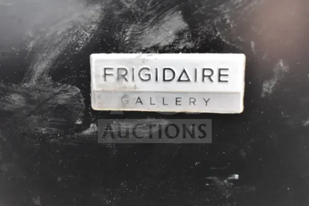 Frigidaire Gallery Chest Freezer label on a black surface, indicating model name and series.