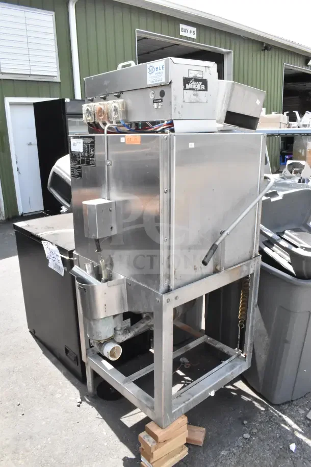 CMA AH-2 Commercial Dishwasher, stainless steel, straight pass through design. Visible controls and hoses, moderate wear.