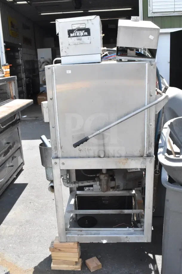 CMA AH-2 Commercial Straight Pass Through Dishwasher, used condition, visible manufacturer label, sturdy metal frame.