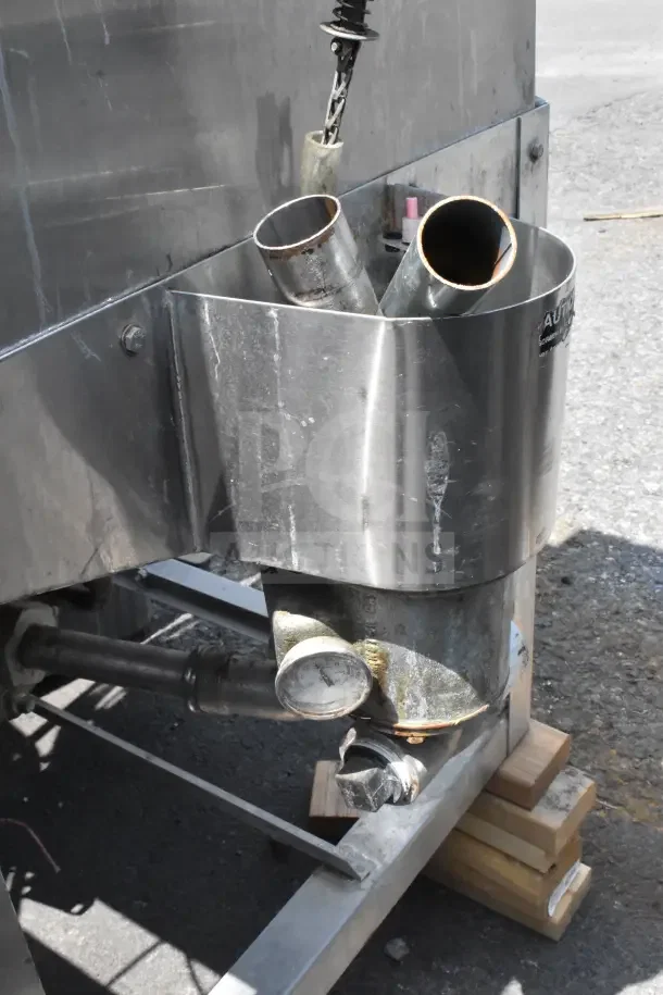 CMA AH-2 Commercial Dishwasher, stainless steel, visible pipes, wear visible, mounted on wood blocks, model label intact.
