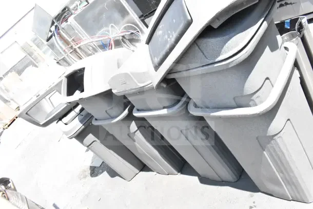 8 Toter gray poly trash cans, durable plastic, outdoor use, stackable with lids, visible handles. Auction: 8 times bid.