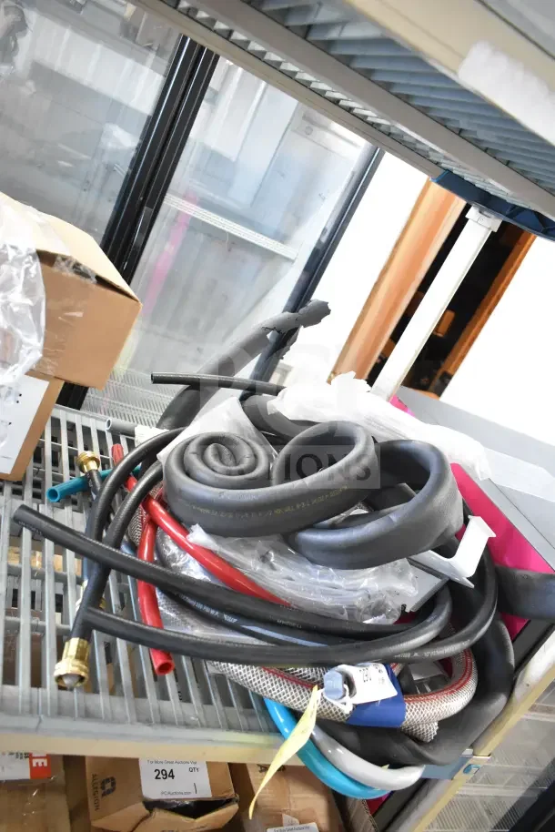 Brand new lot of 18 items, including K6463 thermometer and hoses, on metal shelving in box. Mint condition.