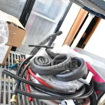 Brand new lot of 18 items, including K6463 thermometer and hoses, on metal shelving in box. Mint condition.