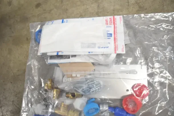 18 new items in box including 92220011, K6463 thermometer, 01551365, and hoses. Various components visible in packaging.