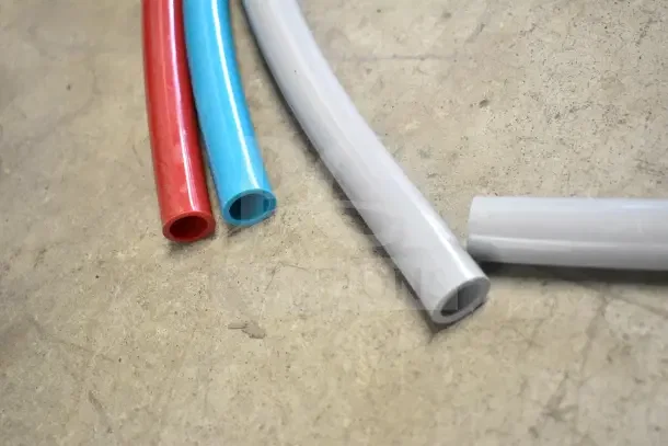 Assorted colored hoses, new condition. Part of 18-item auction lot including Freezer/Dry Storage Thermometer, boxed items.