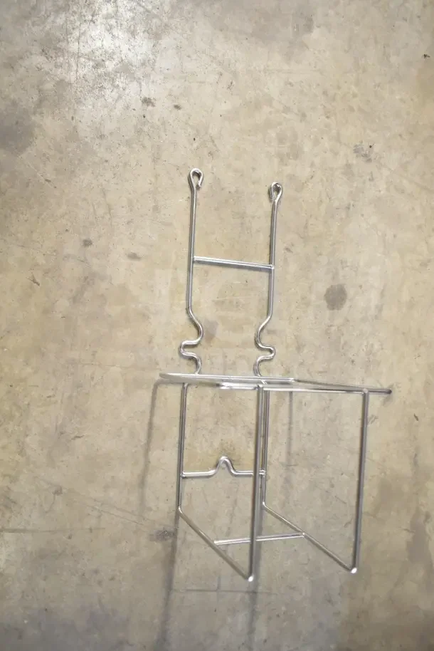 Brand new metal rack, part of a 4-piece set with soap dispenser and IBD bin kit, in original packaging.