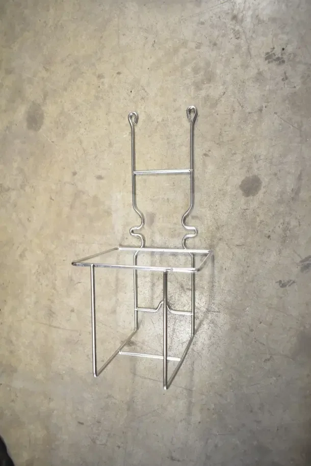 Metal wall-mounted rack, new condition, part of auction lot with soap dispenser and bin kit.