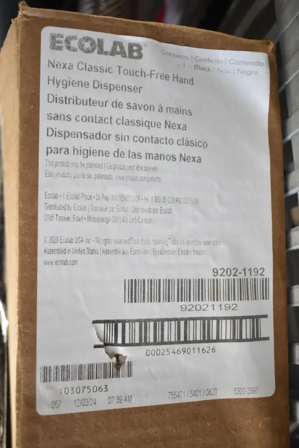 Ecolab Nexa Classic Touch-Free Hand Hygiene Dispenser, new in box, labeled in English, French, and Spanish, barcode visible.