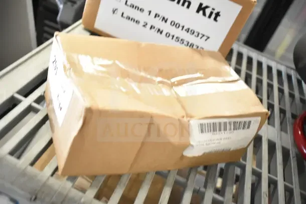 Brand new boxed items including a soap dispenser, rack, and IBD Bin Kit with visible product labels.