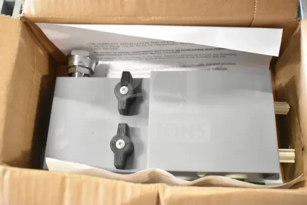 Box containing brand new soap dispenser, rack, IBD bin kit, with tags showing model and installation instructions visible.