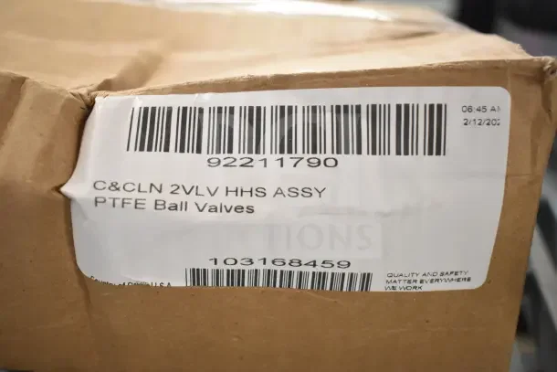 Cardboard box with a label showing barcodes and text: "C&CLN 2VLV HHS ASSY PTFE Ball Valves." Box appears sealed.