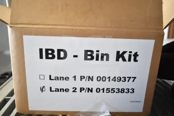 Cardboard box labeled "IBD - Bin Kit" with item numbers; new condition. Includes soap dispenser, rack, bin kit.