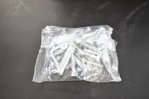 Bag of mounting hardware for a Falcon SC81A Door Closer, sealed in clear plastic, brand new condition.