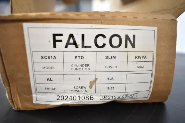 New Falcon SC81A door closer in box, labeled "STD SLIM RWPA," model SC81A, cylinder function, AL finish, screw pack 1.