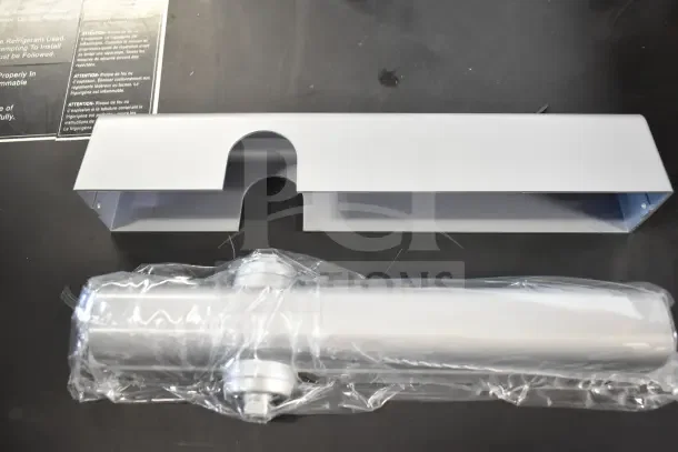 BRAND NEW Falcon SC81A Door Closer in original packaging. Silver finish, includes cover and mechanism, unused condition.