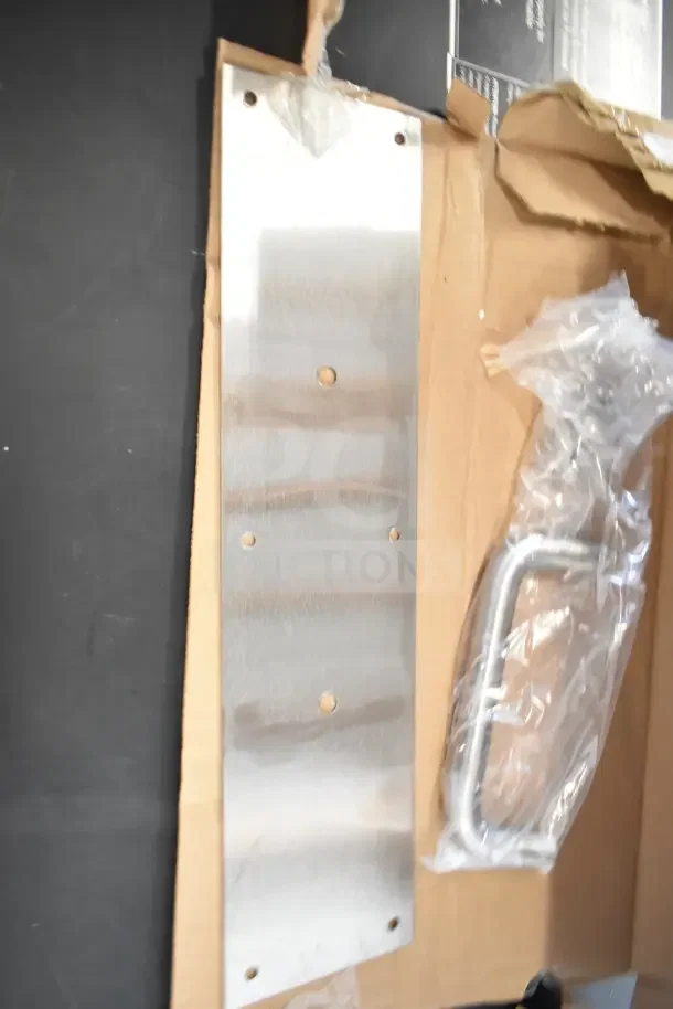 Brand new Uline H-11985SS pull plate in box, includes stainless steel plate and handle. Unused condition, original packaging.