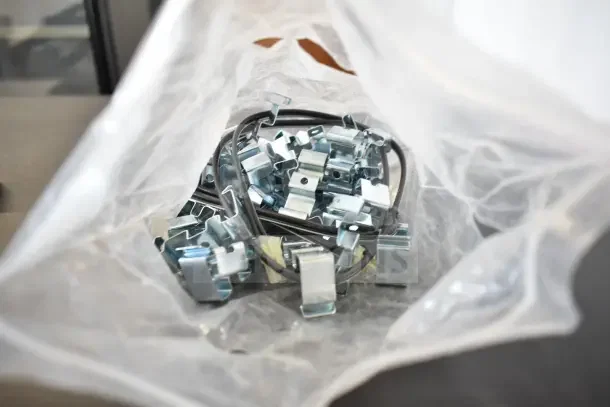Bag of new metal hinges, marketed as 4 times your bid, suitable for various installations.