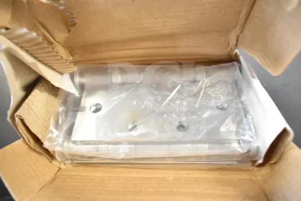 Box of four brand new metal hinges, sealed in plastic, displayed inside partially opened cardboard packaging.