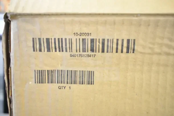 Brand new Roval 10-20031 toilet tissue dispenser in sealed box. Box has barcodes and model number visible.