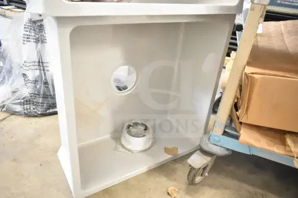 Brand new poly mop sink in box, pristine condition, with drainage hole and attached labels.