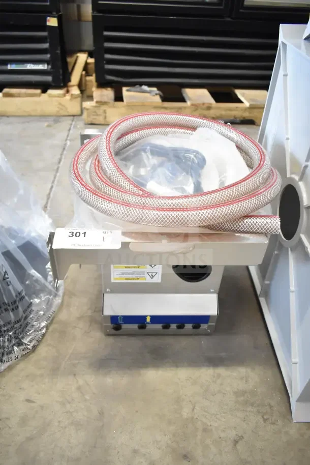 Brand new 2024 Follett IMDV-2CM Diverter Valve, scratch and dent, with attached hose, model label visible, item tag 301.