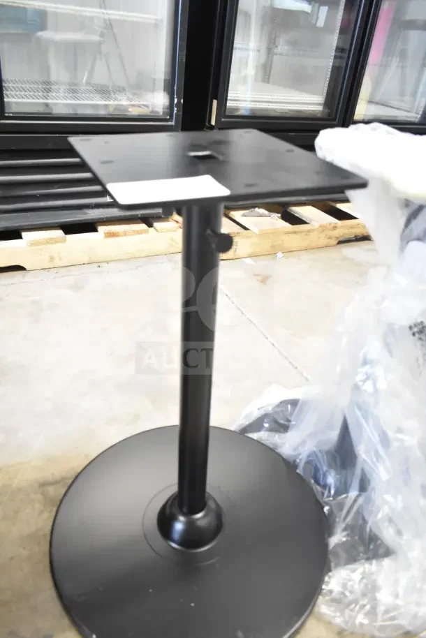 Black metal stand with round base, adjustable height knob. New condition, includes two stands for auction.