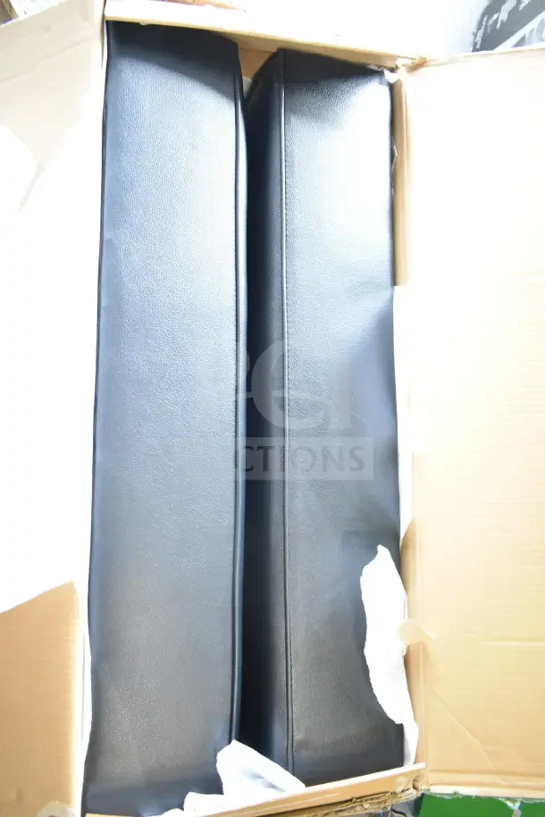 Black ottoman model 7HK144PUBL-D, brand new with minor scratches and dents, shown in shipping box.