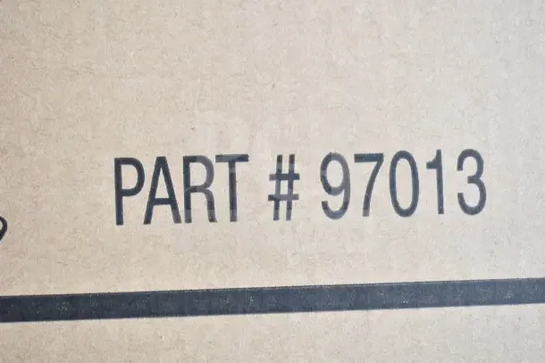 Brown cardboard box with "PART #97013" printed, indicating Adco 18" Stow Away Utility Cart, scratch and dent condition.