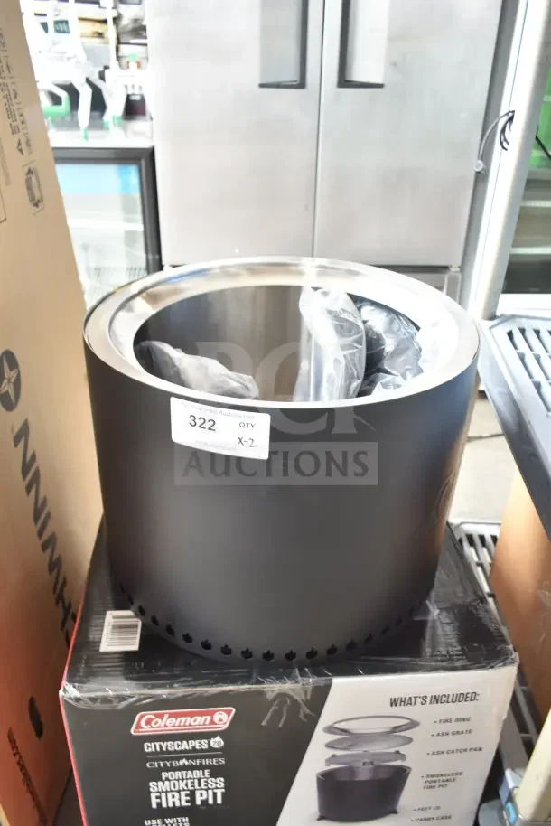 Brand new Coleman Cityscapes Smokeless Fire Pit, scratch and dent. Includes fire ring, ash grate, ash catch pan, and carry case.