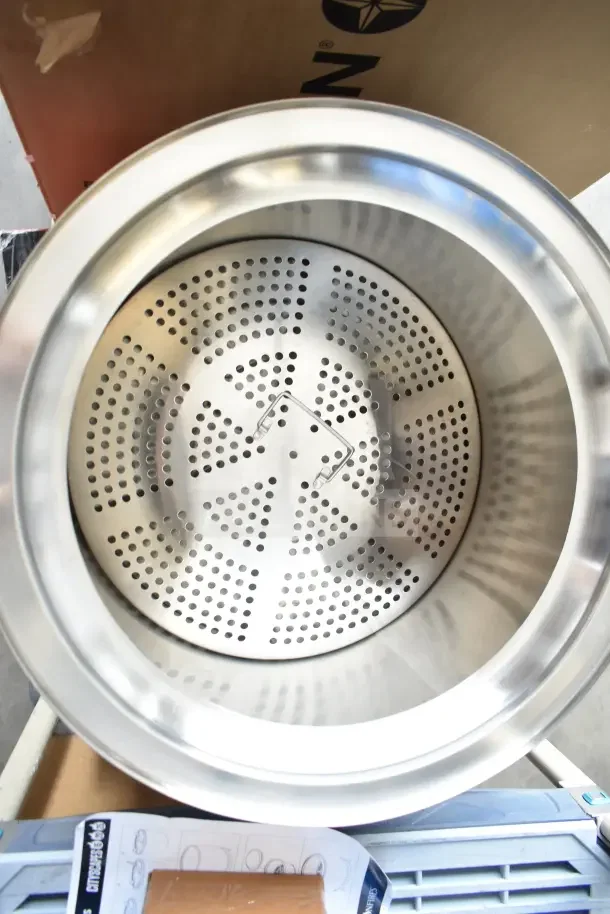 Brand new Coleman smokeless fire pit, stainless steel, scratch and dent condition, round with perforated bottom.