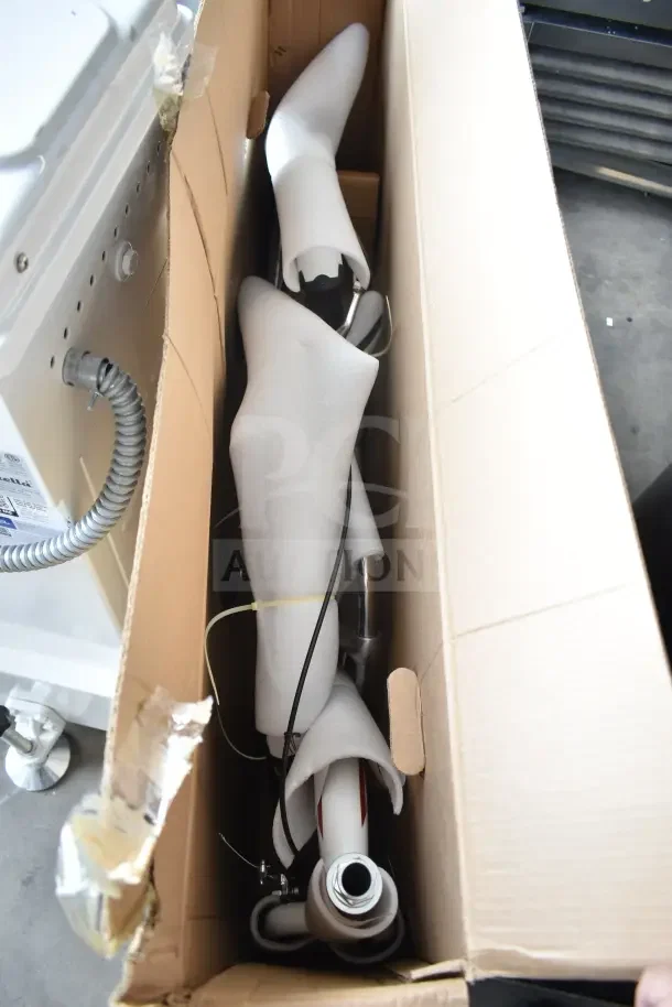 Brand new Schwinn Shuffle 26" adult scooter in white, boxed. Visible scratch and dent, protective foam wrapping.