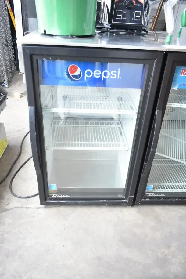 2020 True GDM-06-34-HC commercial mini cooler with Pepsi logo, glass door, in used condition, 115 volts, 1 phase.