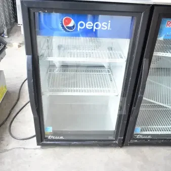 2020 True GDM-06-34-HC commercial mini cooler with Pepsi logo, glass door, in used condition, 115 volts, 1 phase.