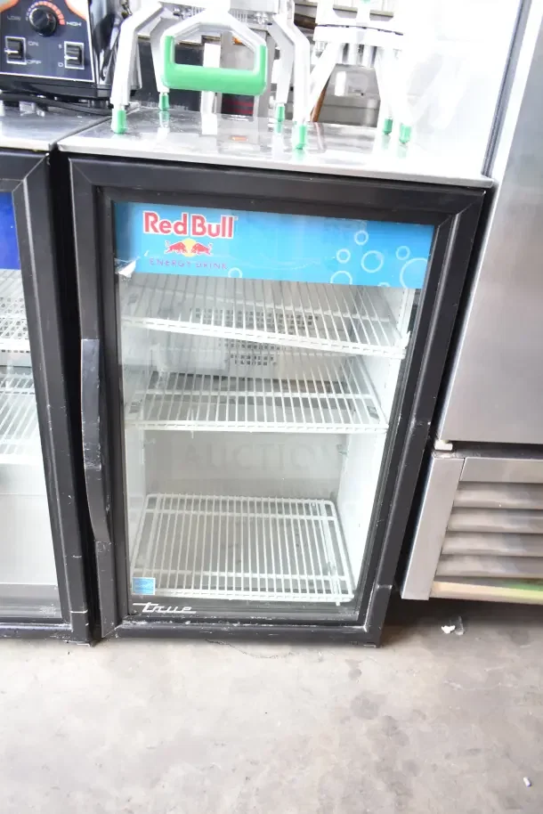 2020 True GDM-06-34-HC mini cooler merchandiser, 115 volts, 1 phase, glass door, with Red Bull branding, good condition.