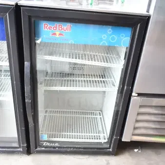 2020 True GDM-06-34-HC mini cooler merchandiser, 115 volts, 1 phase, glass door, with Red Bull branding, good condition.