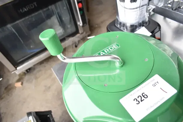 Brand new Garde lettuce spinner, green, manual crank handle, slight scratch, auction tag 326, PCI Auctions label.