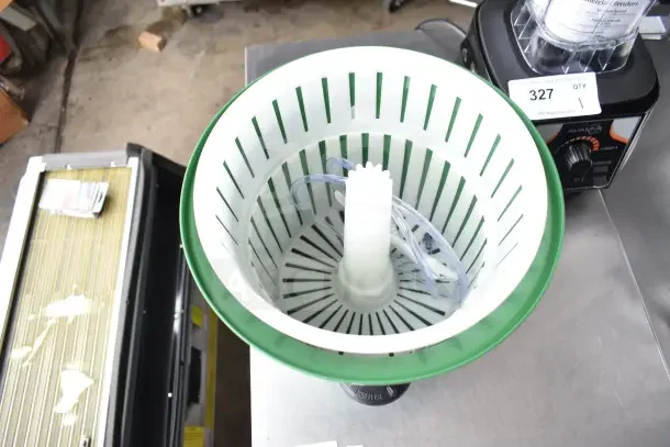 Brand new Garde lettuce spinner with minor scratches. White interior basket, green rim, includes spin mechanism.