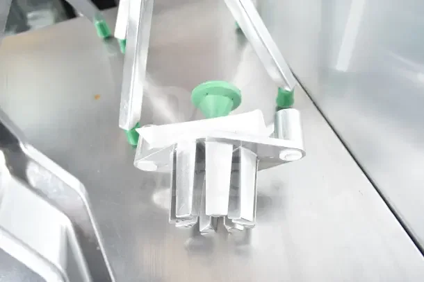 Brand new Garde 181CORE8, 8-section apple corer, with minor scratches and dents, stainless steel, green plastic accents.