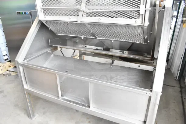 Pisces Fish Machinery DS150 Commercial Drum Scaler, stainless steel, used condition, visible mesh panels, industrial setting.