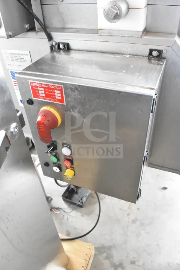 Pisces Fish Machinery DS150 Commercial Drum Scaler, stainless steel, control panel with safety labels visible.