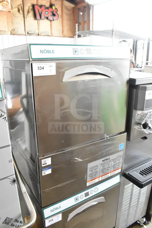 Brand new Noble undercounter dishwasher with minor scratches. Stainless steel finish, labeled with model info and auction tag.