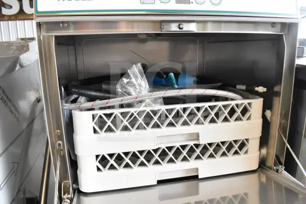 Brand new Noble commercial undercounter dishwasher, minor scratches, includes racks and hoses, durable stainless steel.