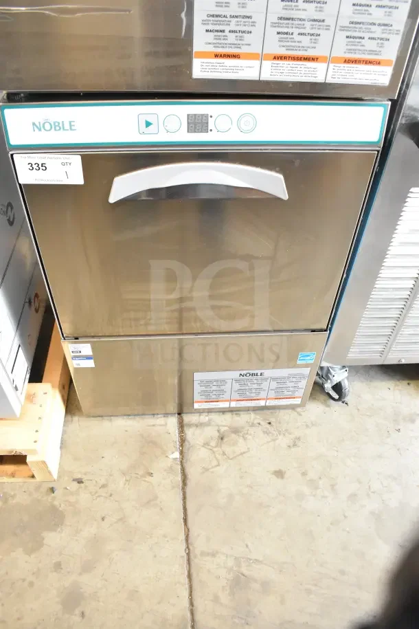 Brand new Noble commercial undercounter dishwasher with visible control panel. Scratch and dent condition. Model labels affixed.