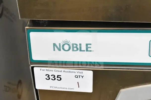 Brand new Noble commercial undercounter dishwasher, scratch and dent condition, visible logo and auction tag #335.