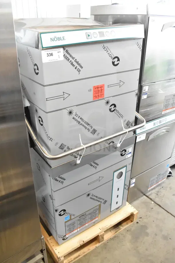 Alt text: Brand new Noble commercial straight pass through dishwasher, scratch and dent condition, on pallet with protective wrapping.