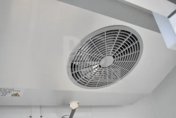 Vent detail of a 2025 Avantco 178A49FHC commercial 2-door reach-in freezer showing fan and warning label.